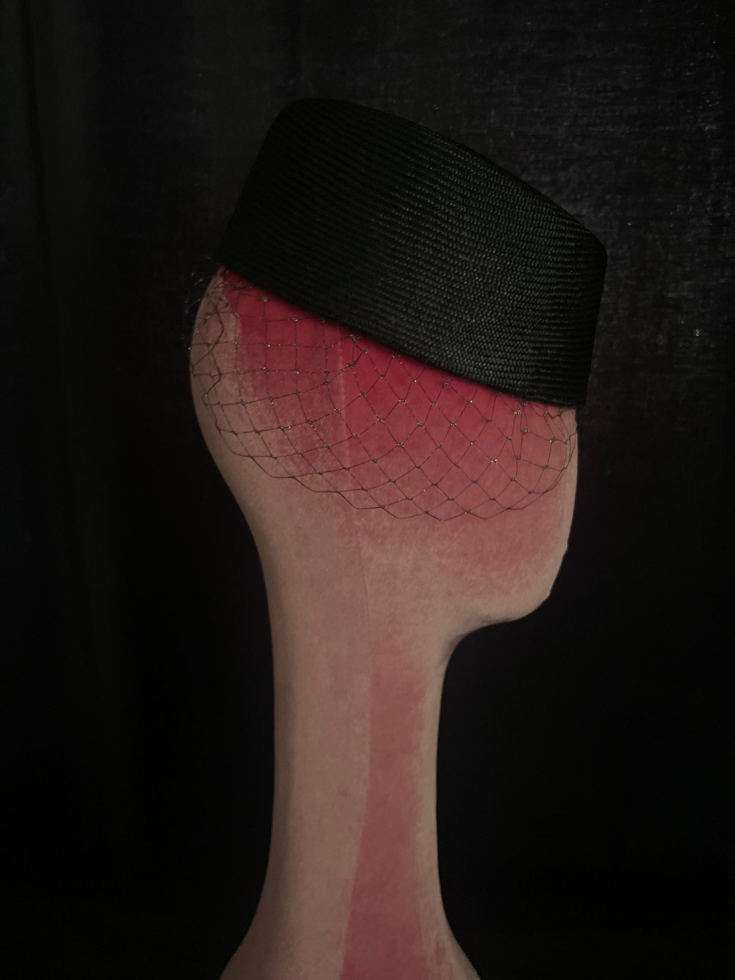 Asymmetric net trimming cocktail hat