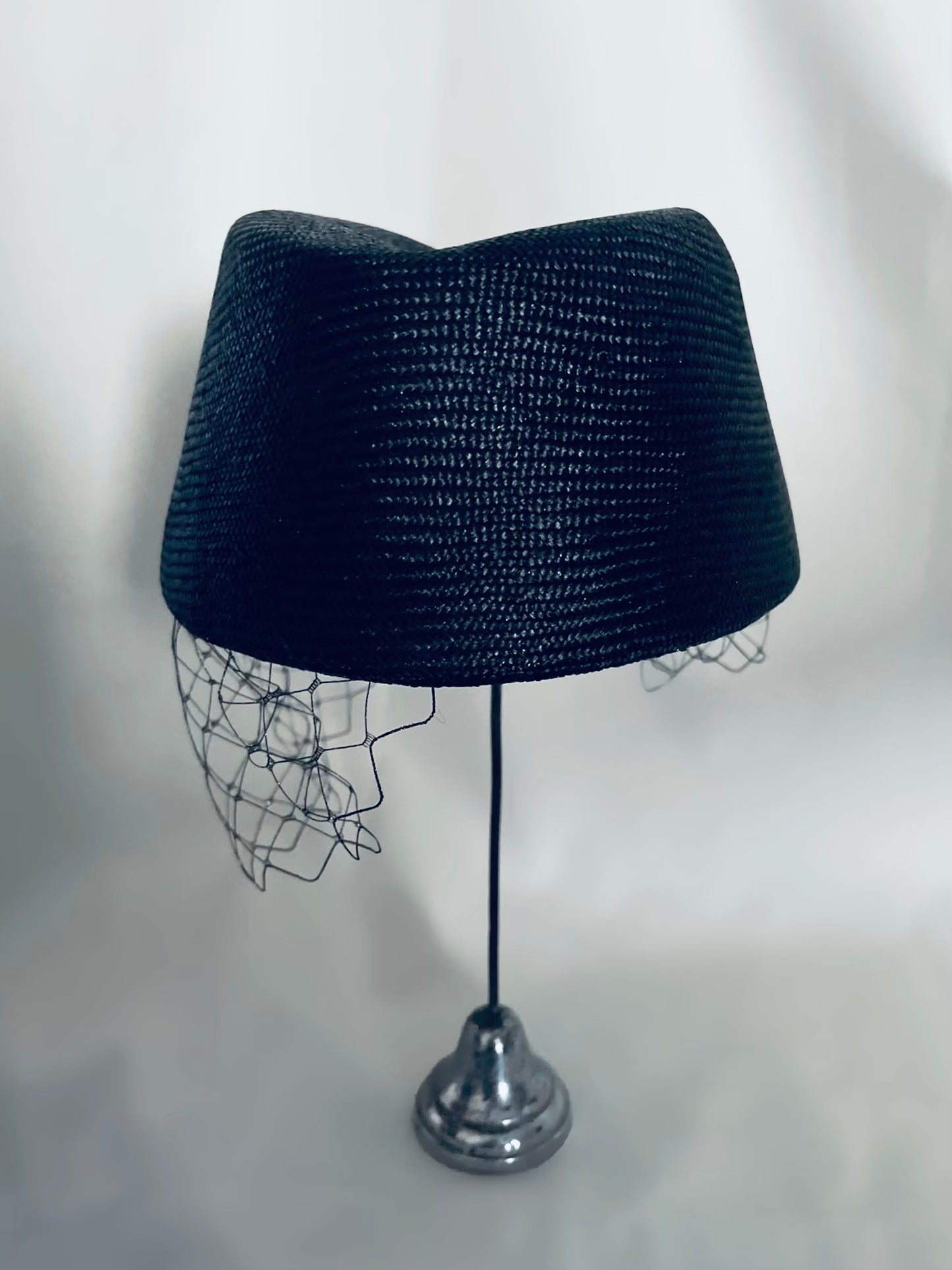 Asymmetric net trimming cocktail hat